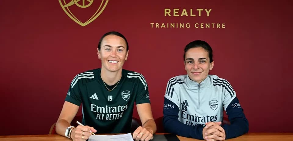 Players signing contracts at Arsenal training center