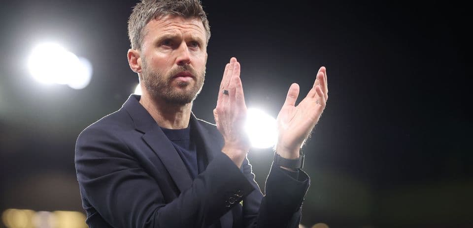 Manager applauding during a match at stadium