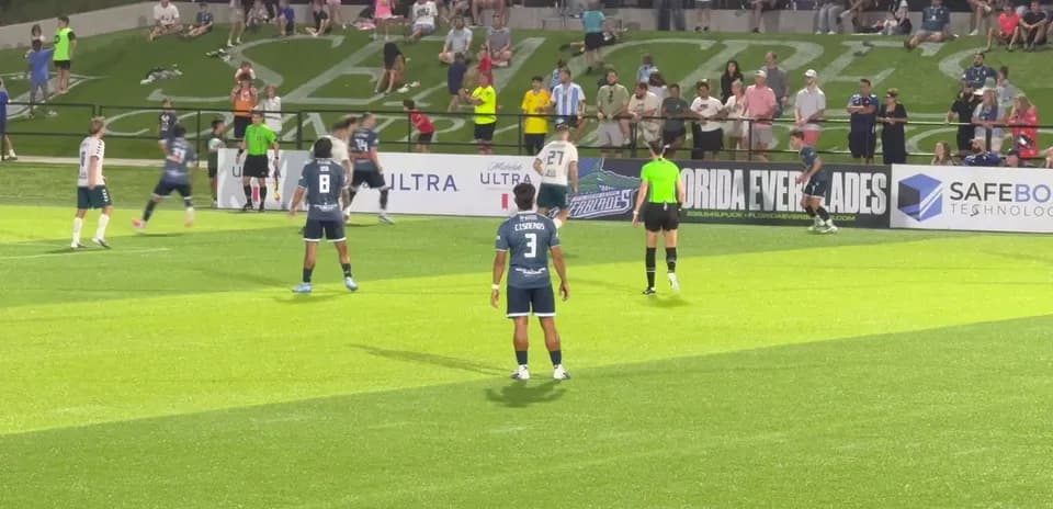 Players preparing for a free kick during match