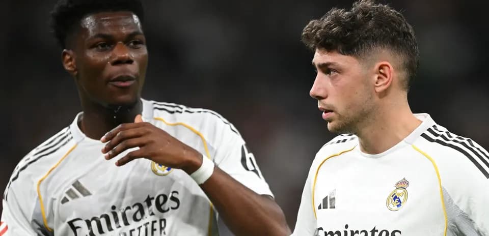 Two Real Madrid players discussing on the field