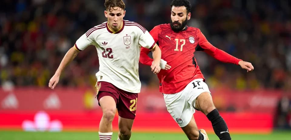 Two players competing for the ball during match