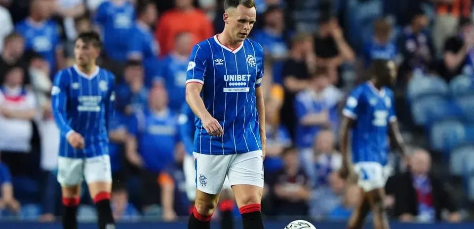Rangers player walking on the pitch during match
