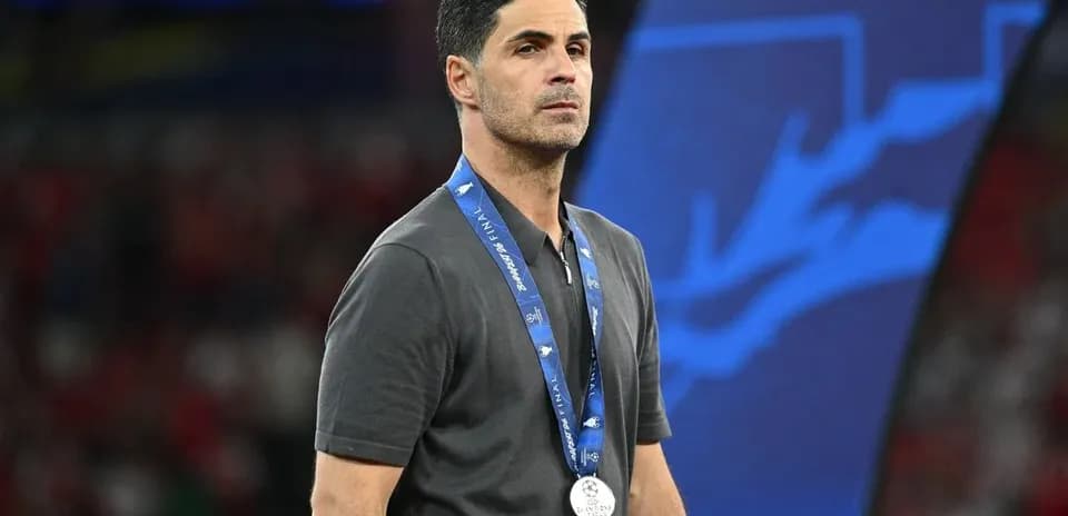 Manager wearing a silver medal at final event