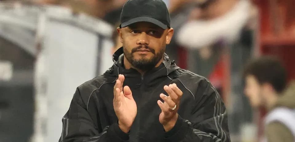 Coach applauding from the sidelines during match