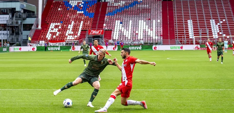 Two players contesting the ball during a match