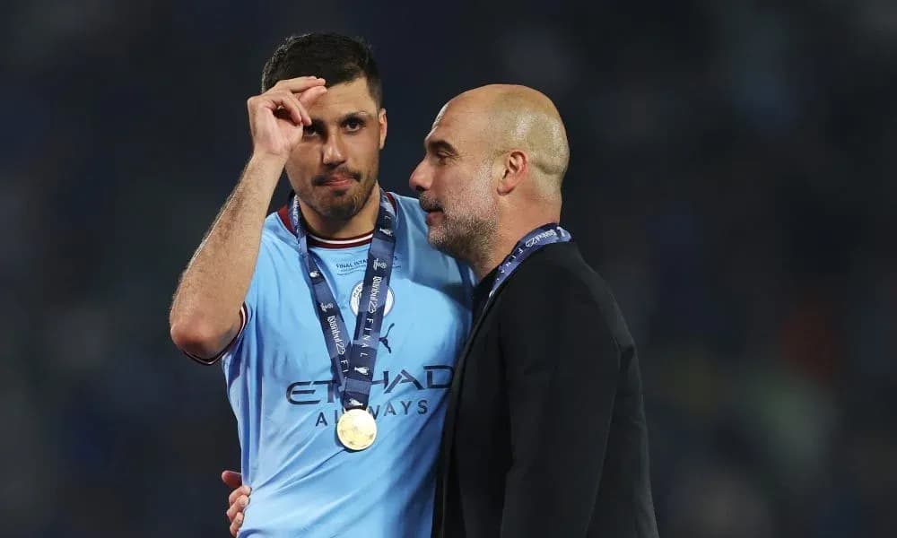 Player and coach celebrating victory with medals