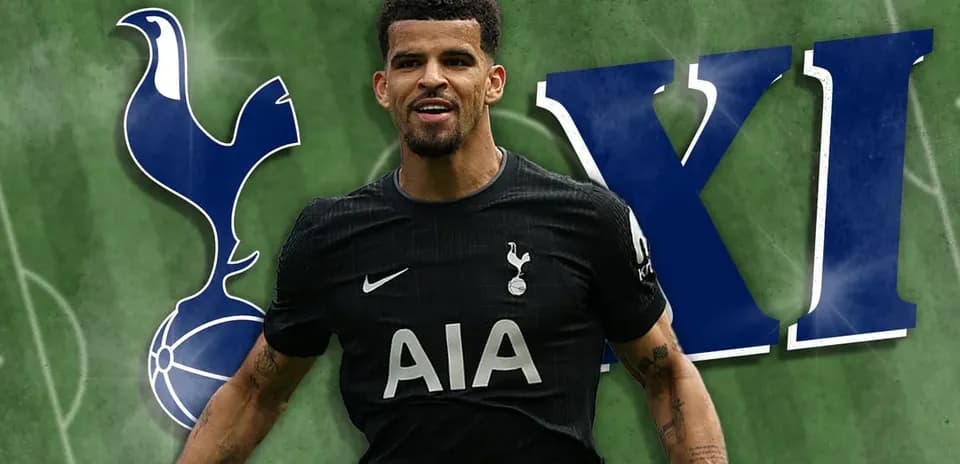 Player celebrating in Tottenham kit on pitch