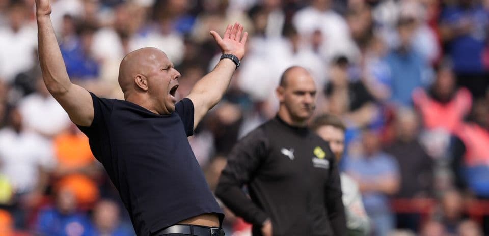 Coach gesturing passionately during a match