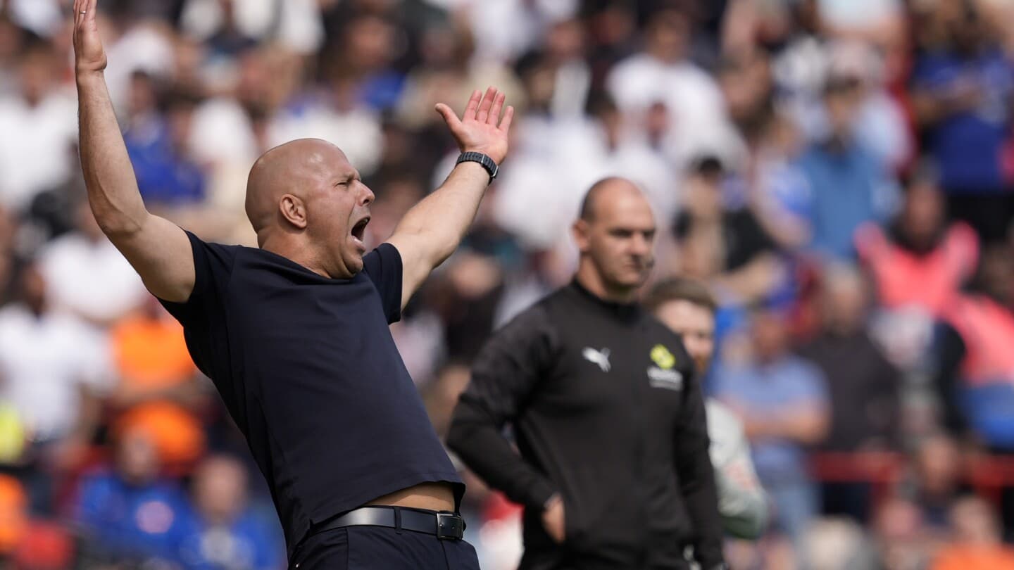 Coach gesturing passionately during a match