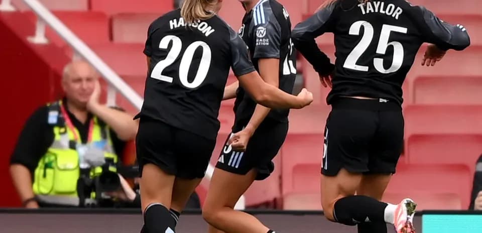 Players celebrating a goal during FA WSL match