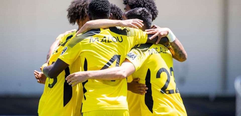 Columbus Crew II players celebrating together