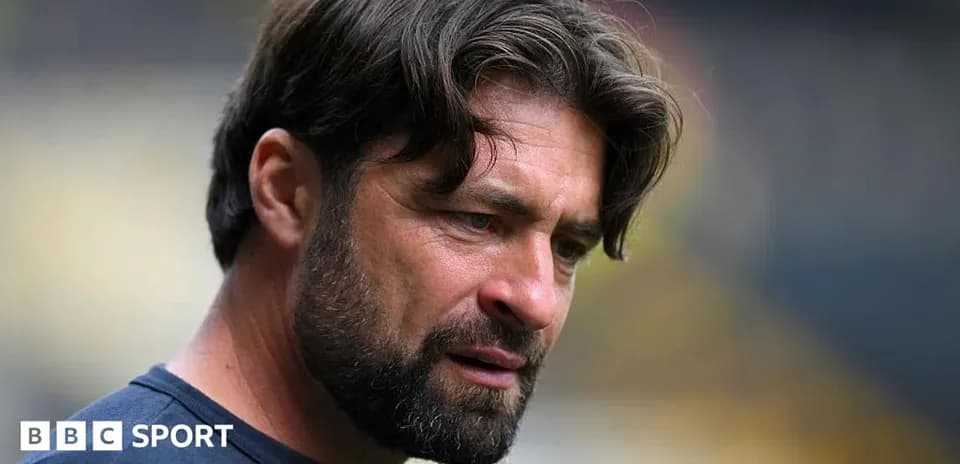 Coach looking thoughtful during a match preparation