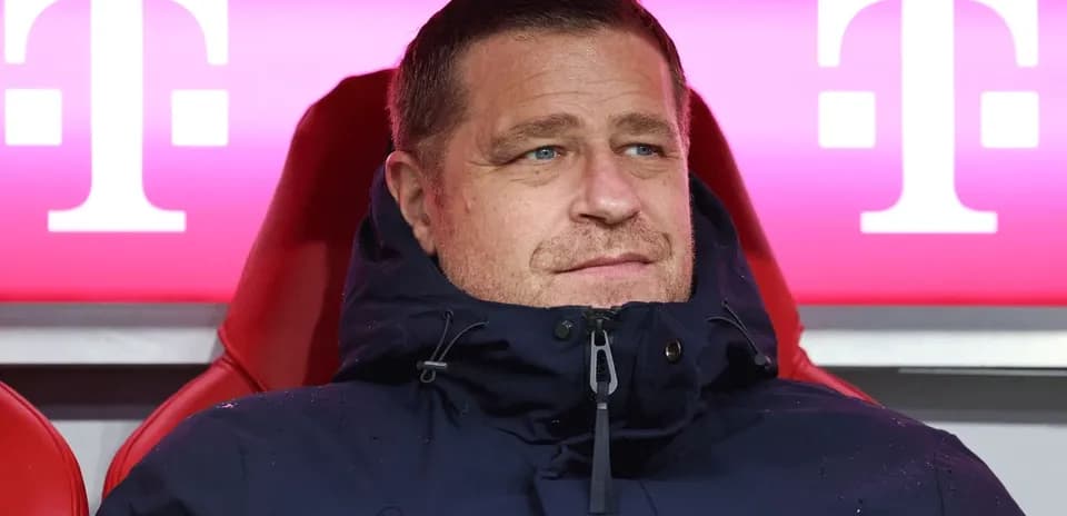 Coach seated on bench during match