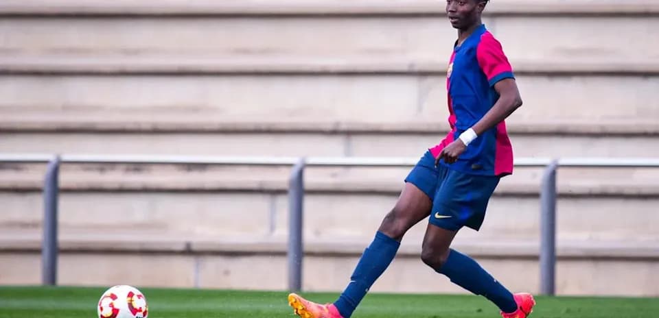 Player in Barcelona kit controlling a soccer ball