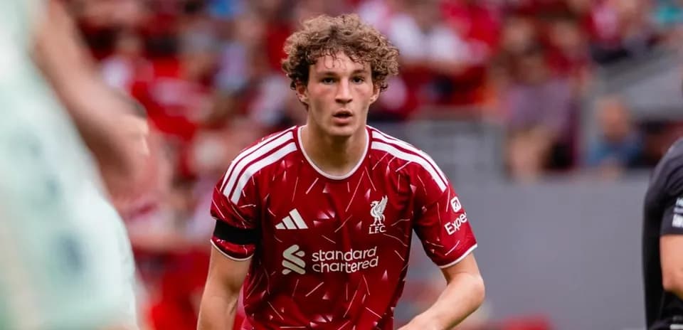 Liverpool player in red kit during match action