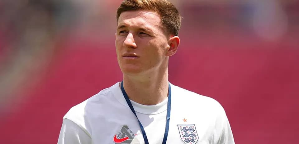 Player wearing England kit on the pitch