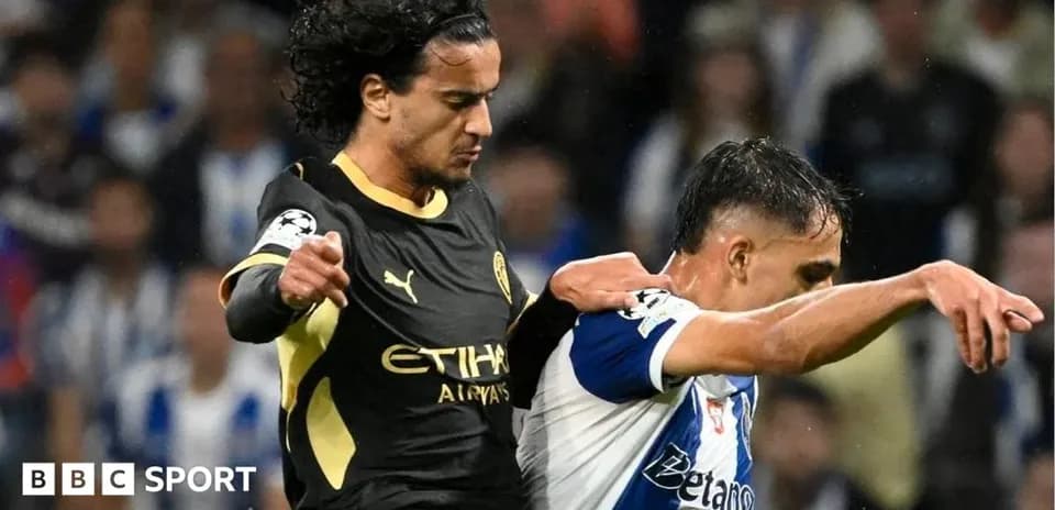 Player tackling opponent during a UEFA Champions League match