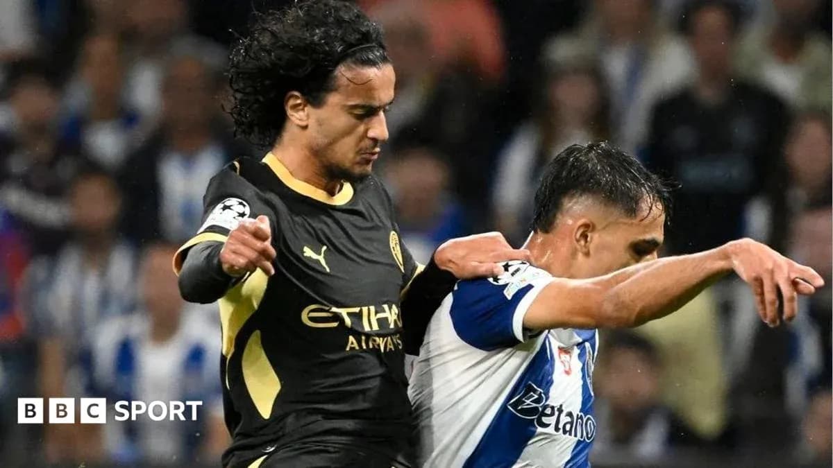 Player tackling opponent during a UEFA Champions League match