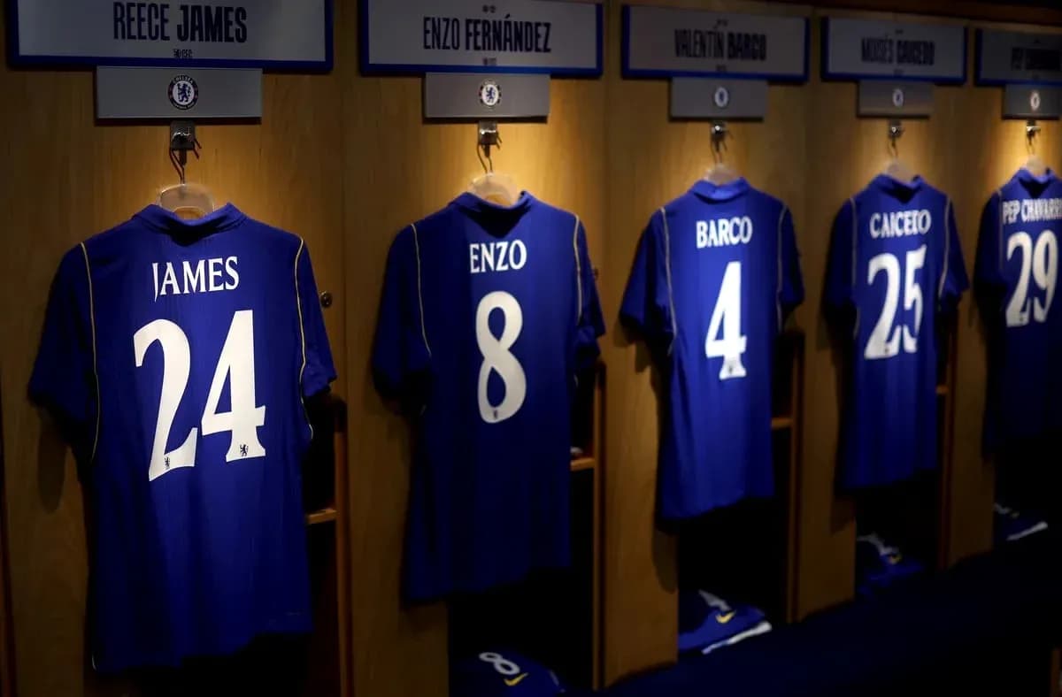 Chelsea jerseys hanging in locker room with names