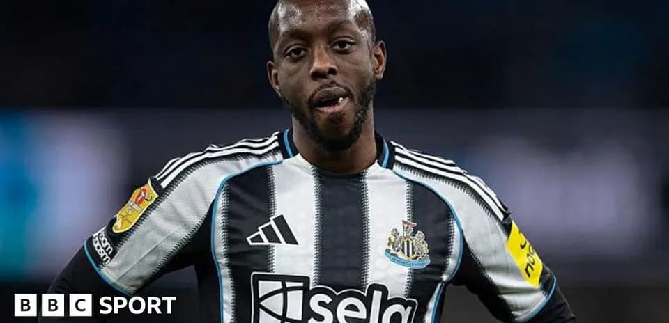 Newcastle player in black and white striped jersey