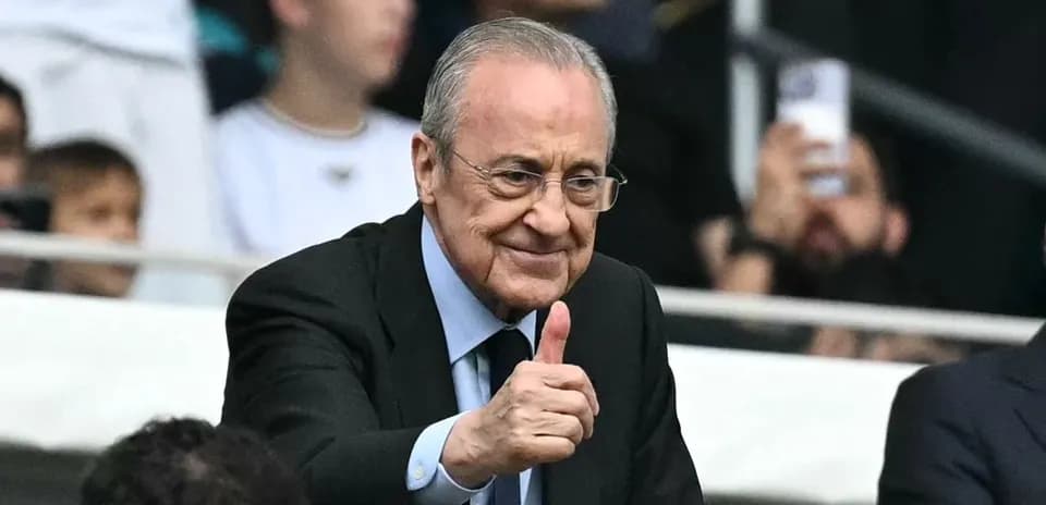 Man giving thumbs up in stadium crowd