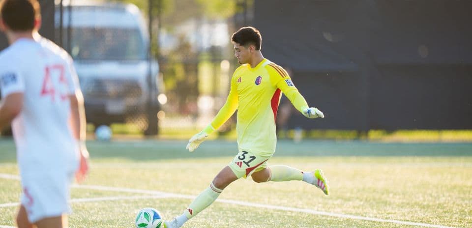 Goalkeeper kicking the ball during match