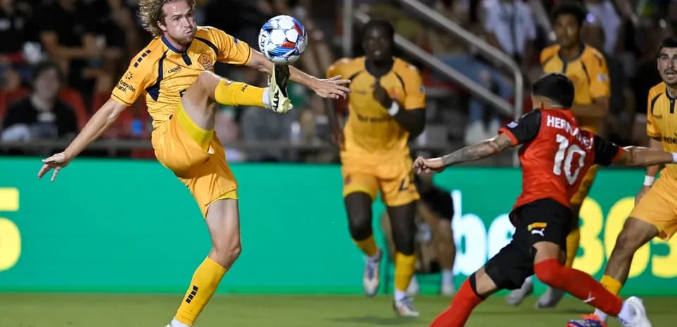 Player kicking ball during Indy Eleven match