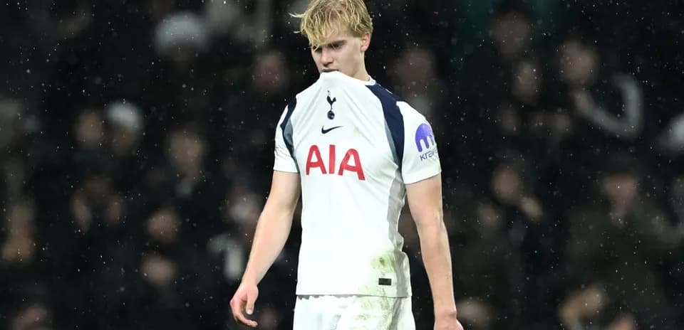 Player looking dejected during a rainy match
