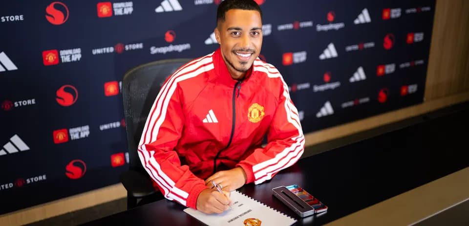 Player signing contract at Manchester United press conference