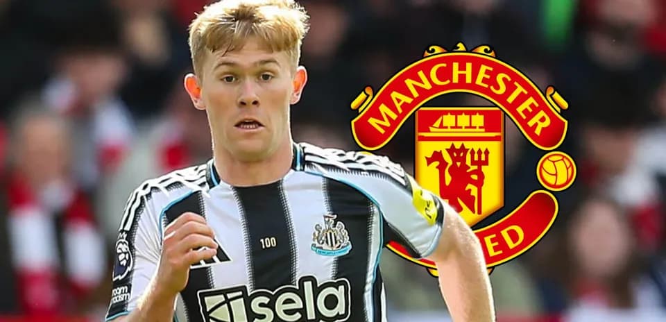 Newcastle player running with Manchester United logo background