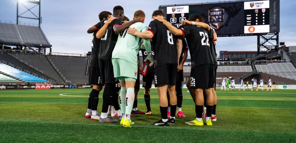 Birmingham Legion players huddling before match