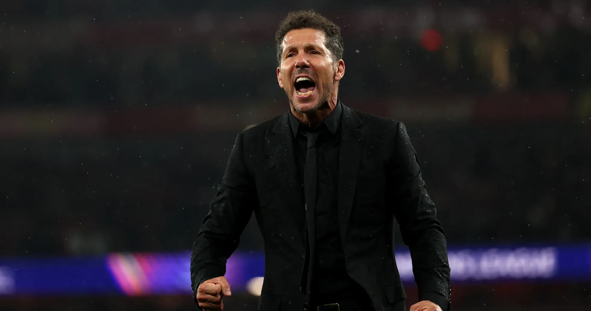Coach celebrating passionately during a match