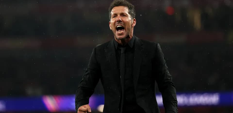 Coach celebrating passionately during a match
