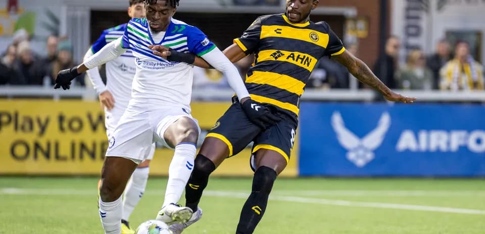 Players competing for the ball during match