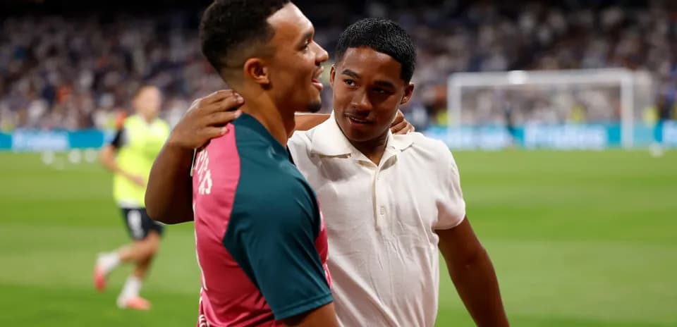 Two players interacting on the field before match