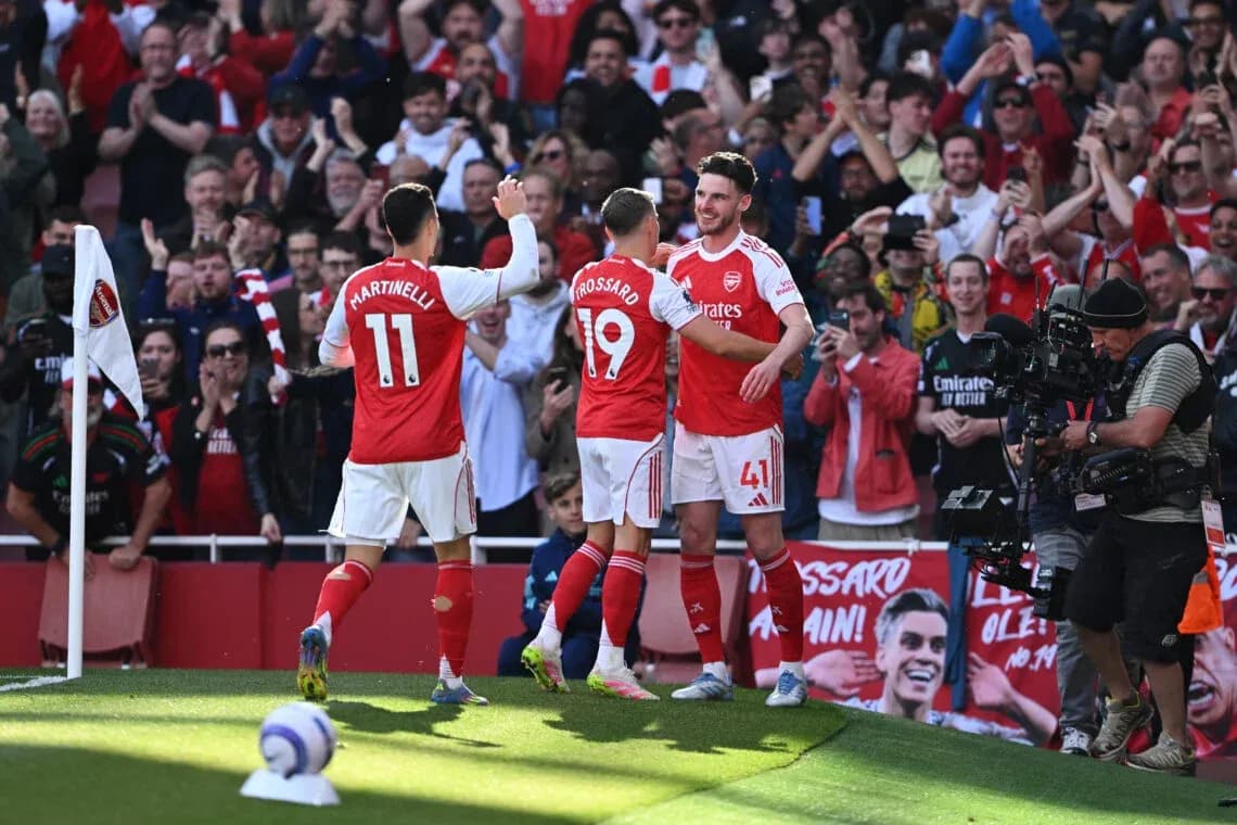 Arsenal players celebrating a goal during match