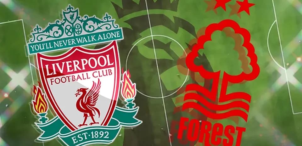 Liverpool and Nottingham Forest club logos on pitch