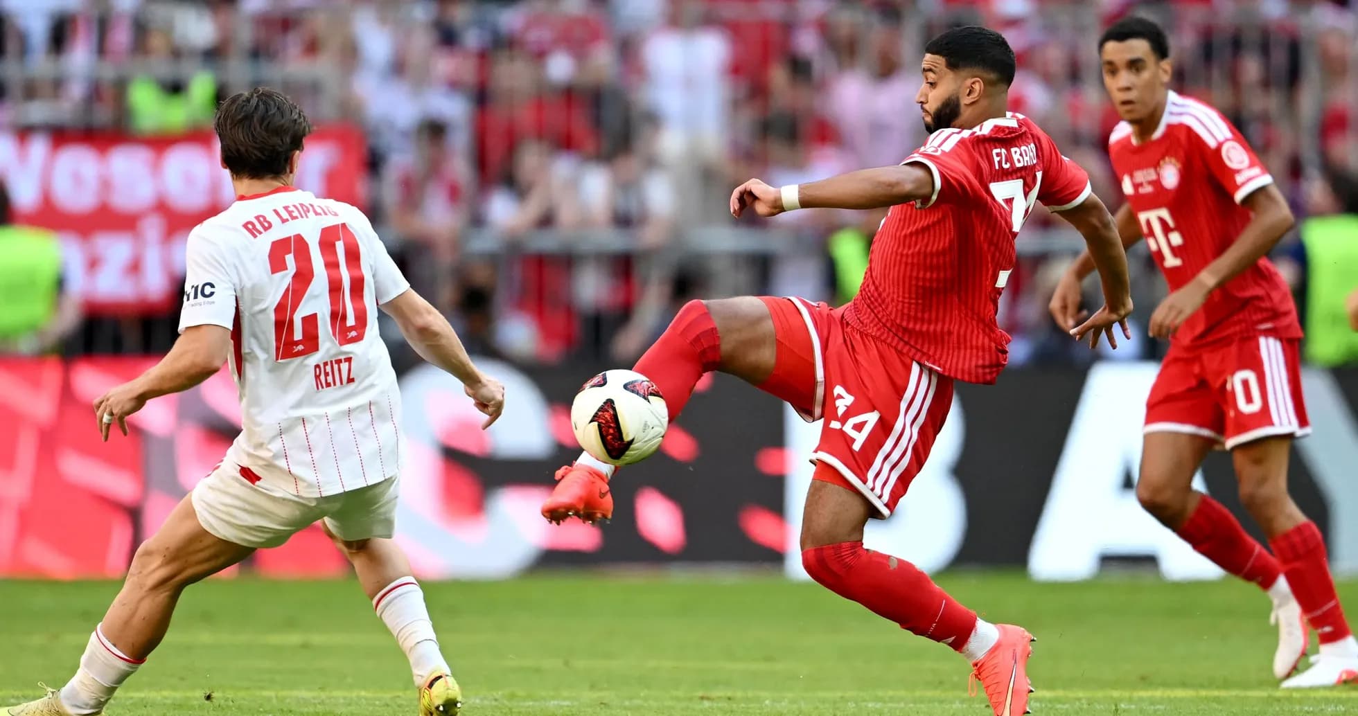 Player from Bayern Munich passing ball during match