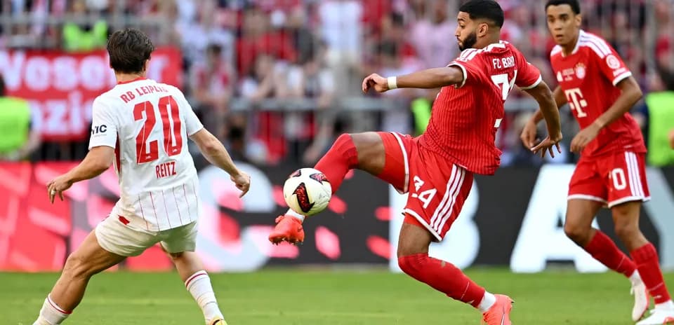 Player from Bayern Munich passing ball during match