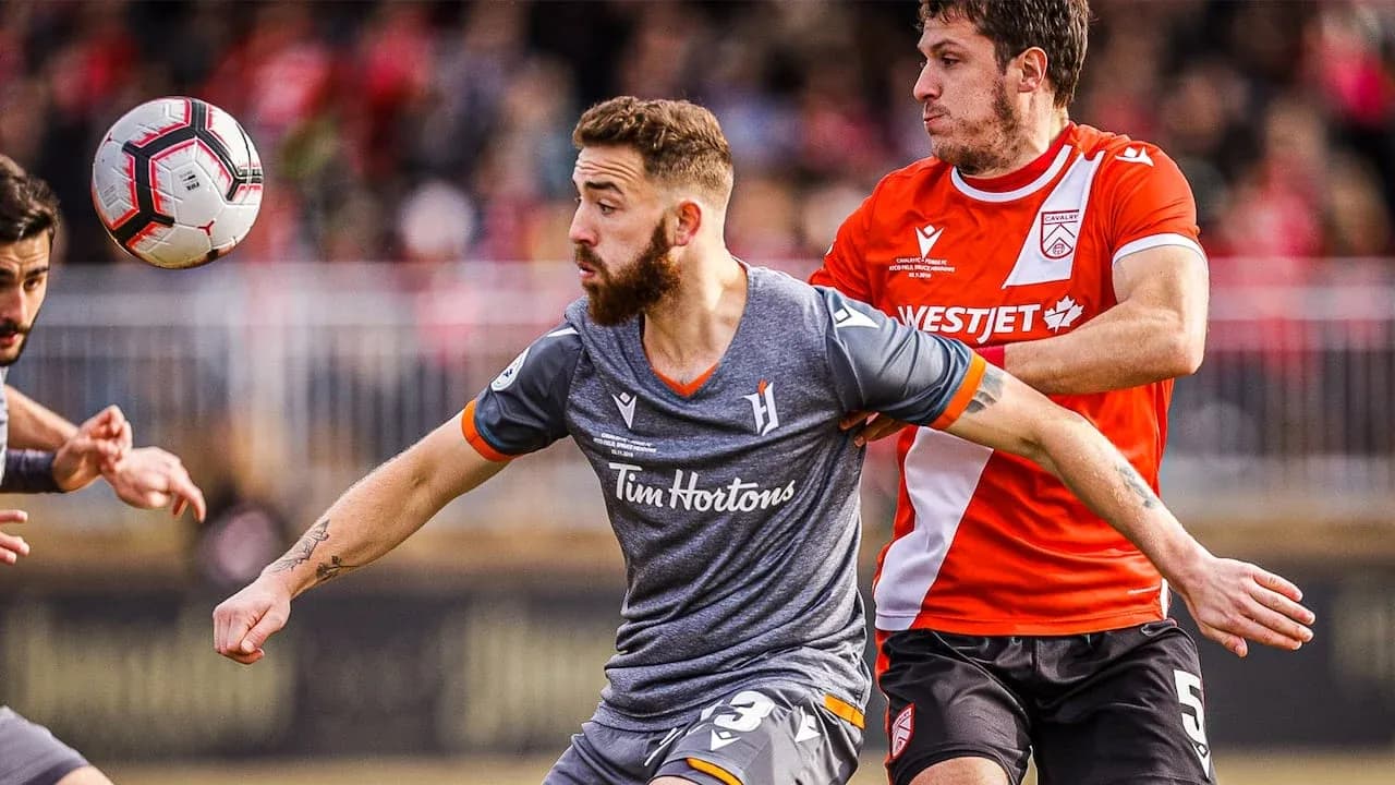 Players competing for the ball during match