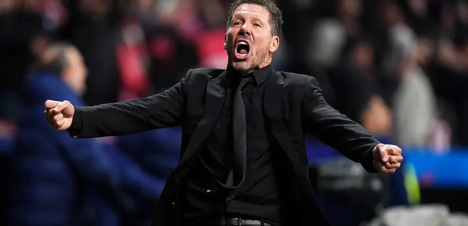 Coach celebrating passionately on the sidelines