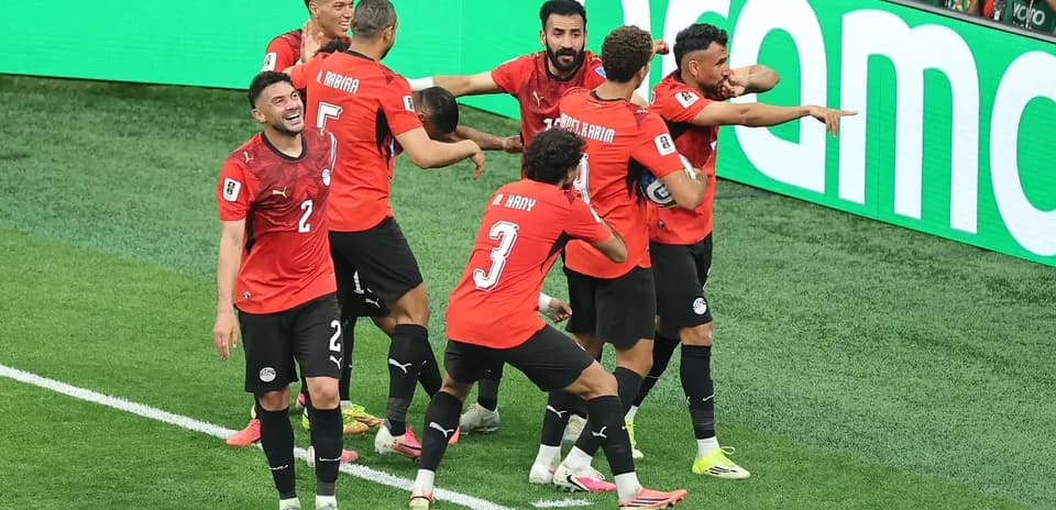Egyptian players celebrating a goal on the field