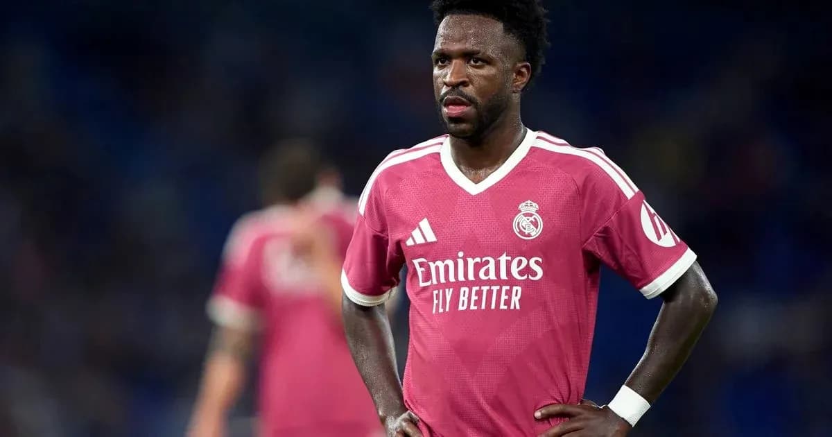 Player wearing pink Real Madrid jersey on field