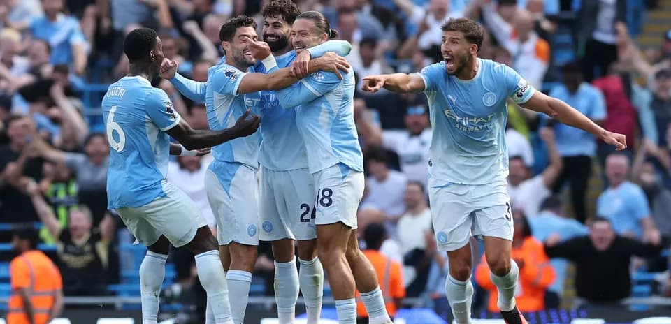 Manchester City players celebrating a goal