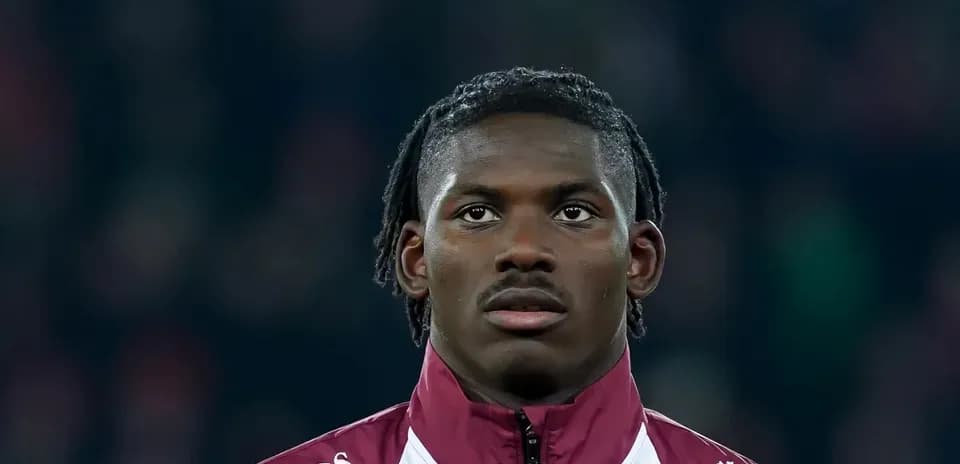 Player in team jacket during match preparation