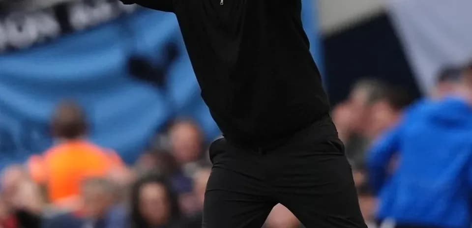 Coach directing players from the sidelines during match