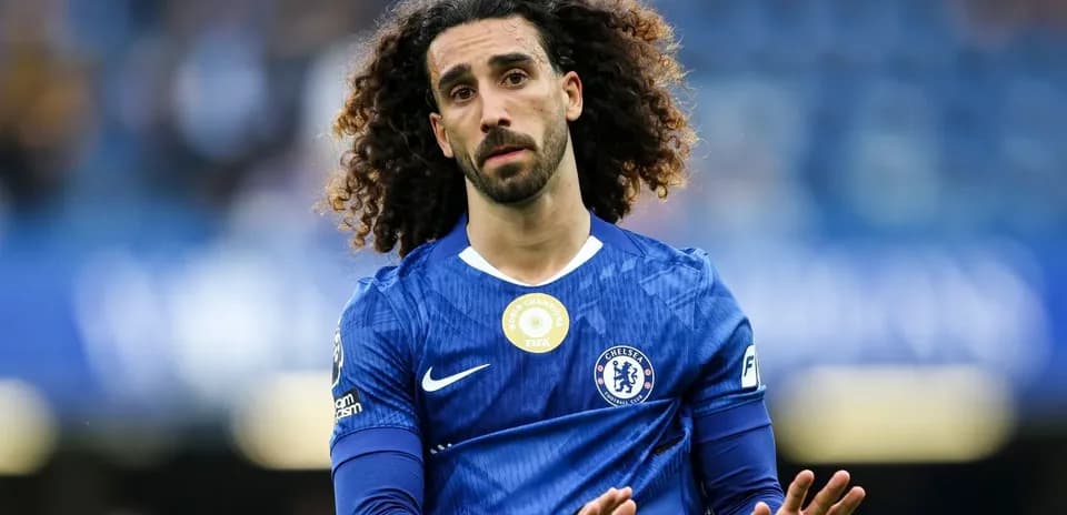 Chelsea player gesturing during match on field