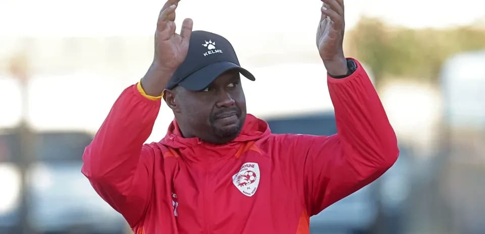 Coach gesturing during training session at field