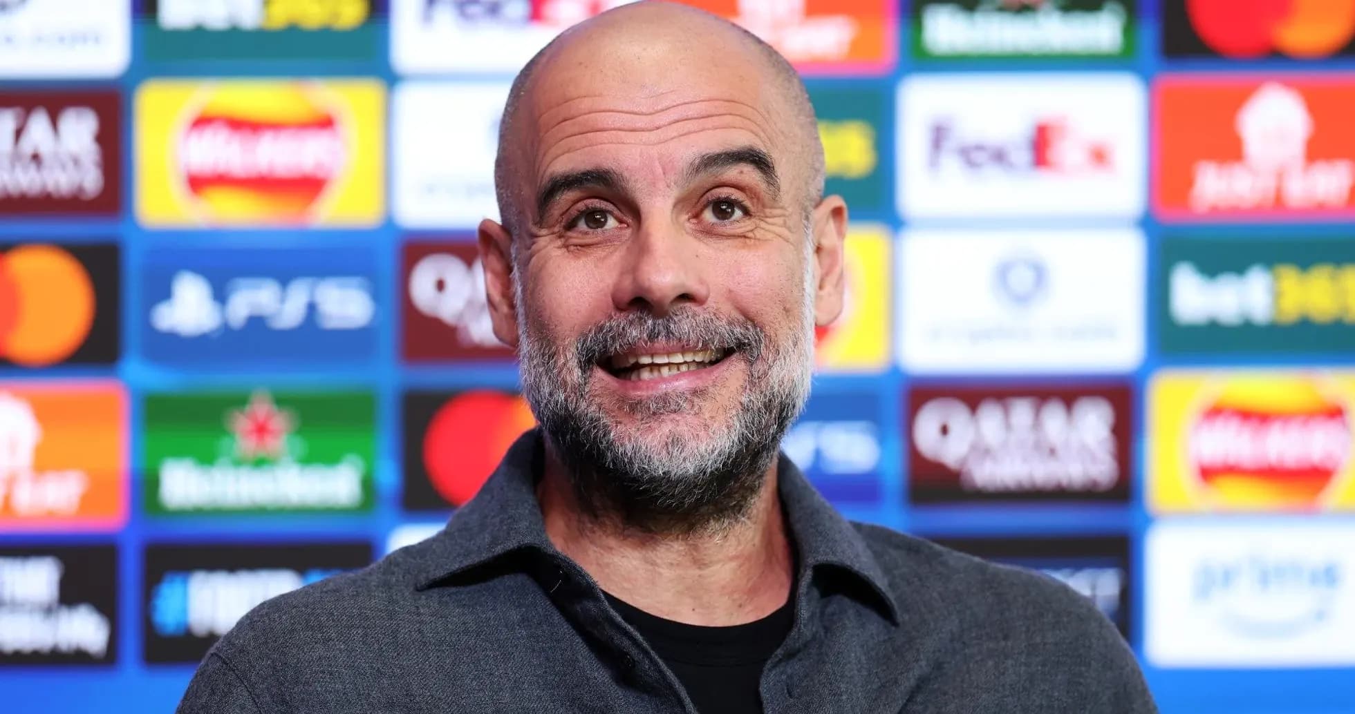 Manager at press conference with sponsor backdrop