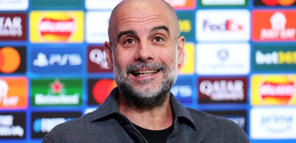 Manager at press conference with sponsor backdrop